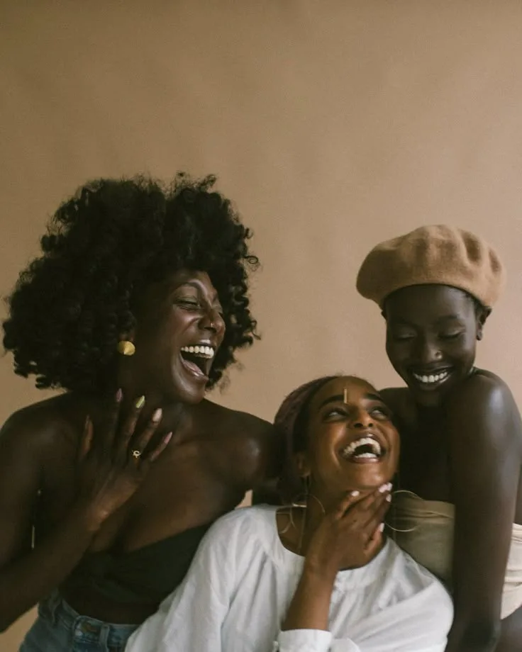 Three smiling women